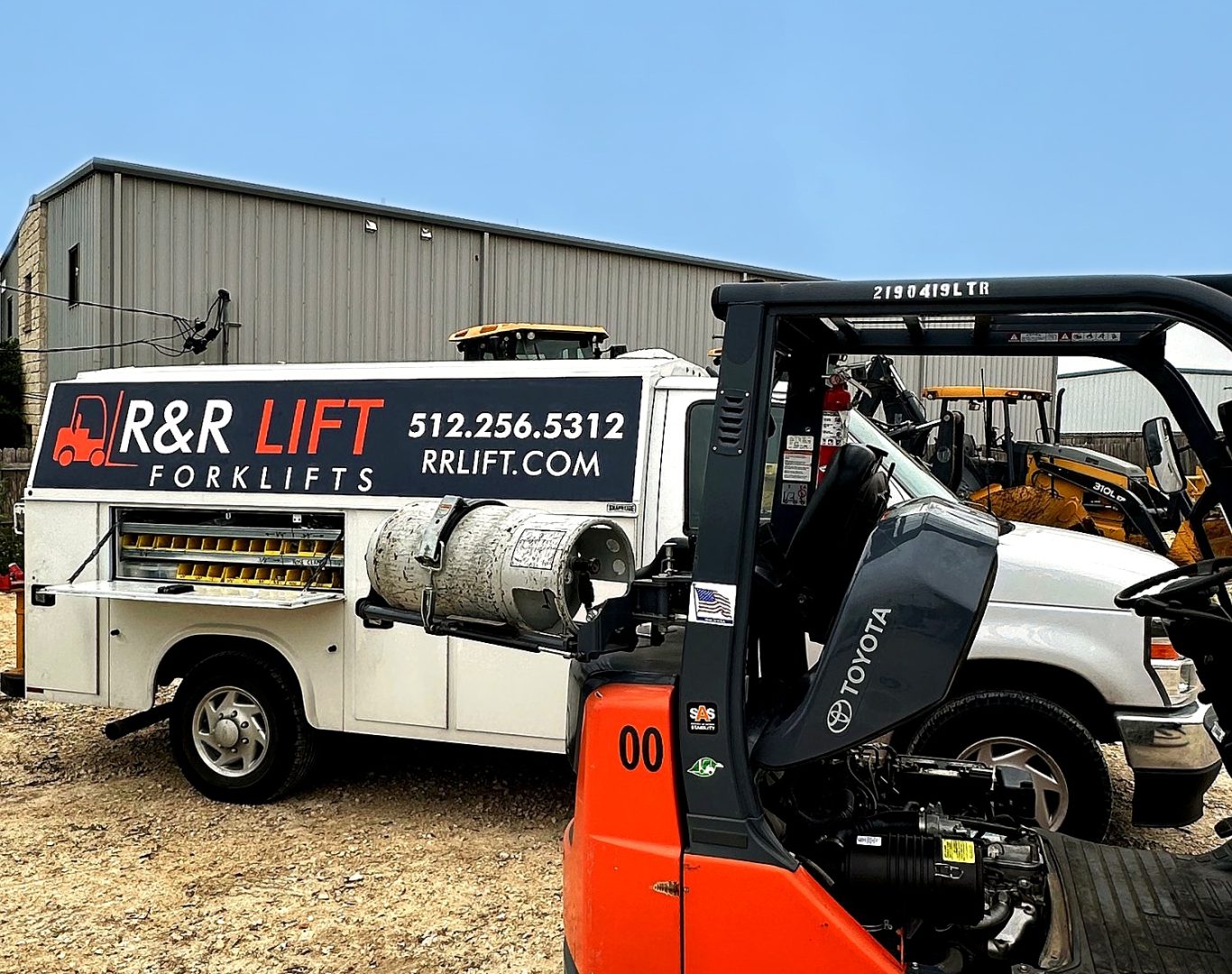 Forklift fleet maintenance scene in a SH 130 corridor warehouse serving Pflugerville industrial operations