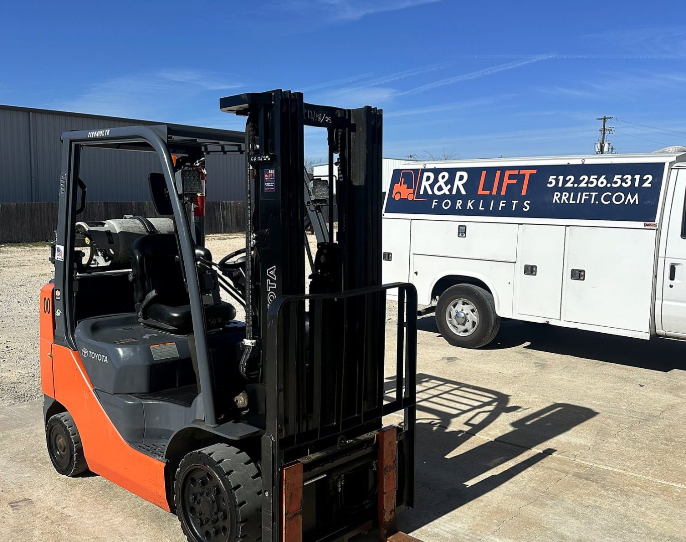 Forklift technician servicing a heavy-duty forklift inside a Central Texas manufacturing facility
